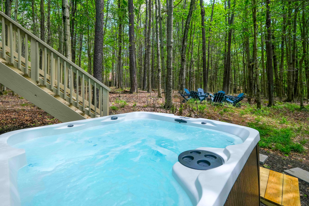 Hot tub surrounded by trees.