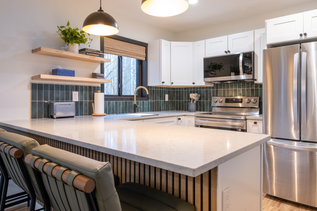 Modern kitchen with dishwasher, microwave.