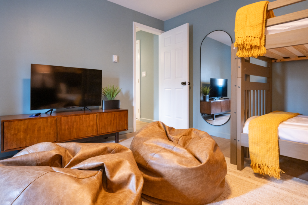Bunk room with bean bags and TV.